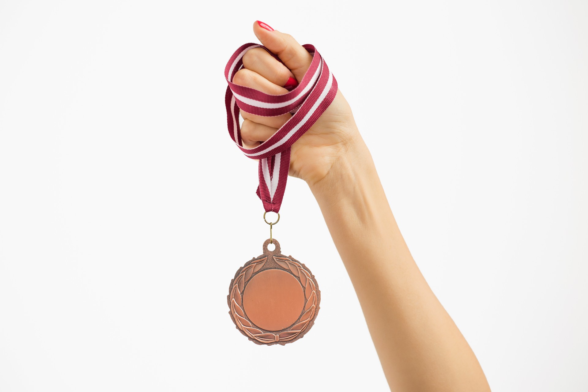 Person holding a medal