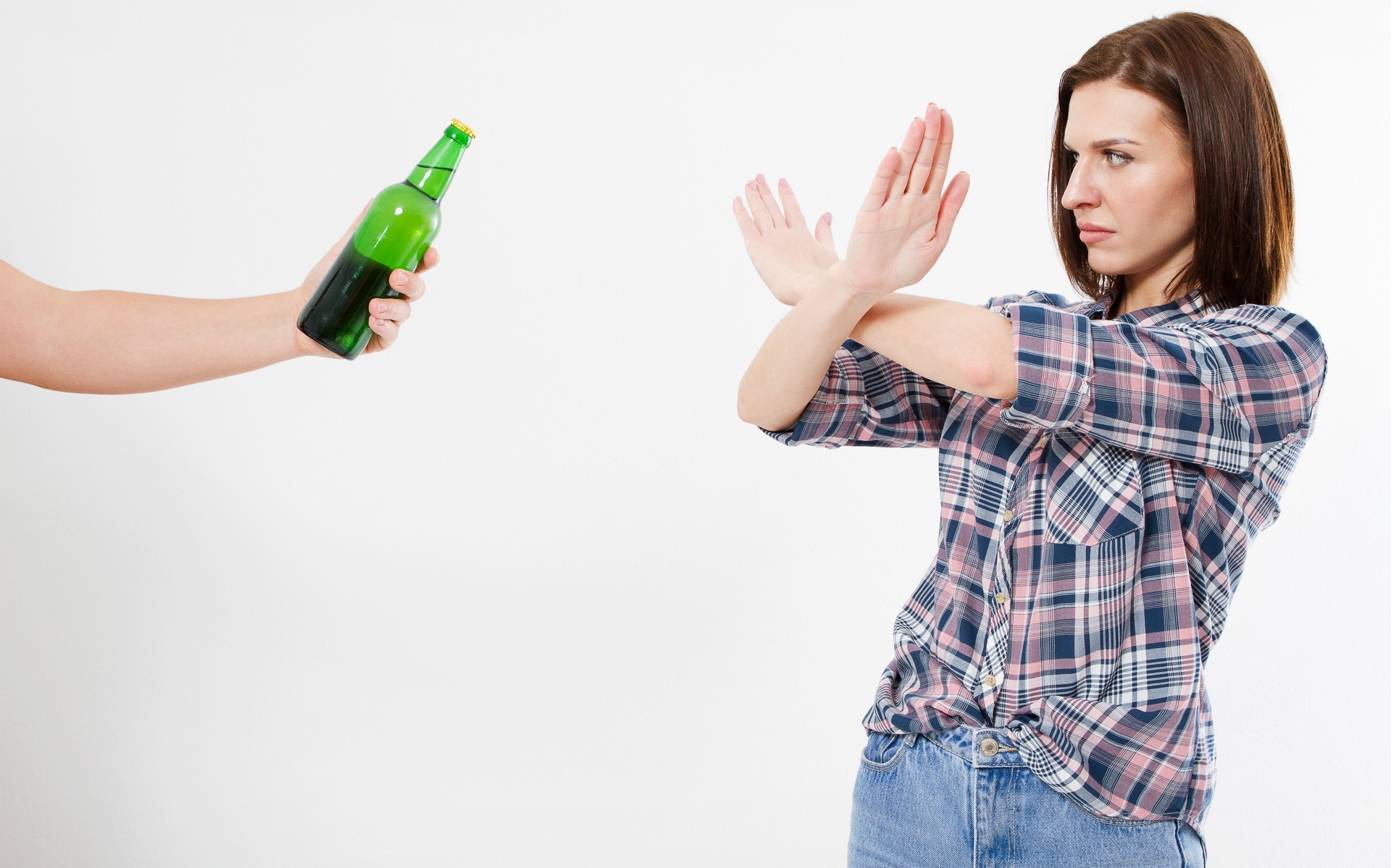 brunette woman refused alcohol drink isolated on white background,anti alcohol concept of healthy lifestyle, healthy eating and no bad habits